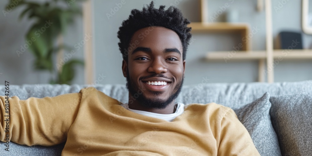 Happy Man Sitting on Couch Happy Man Sitting on Couch