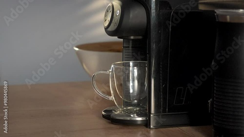 Man making a coffee from machine, morning routine.