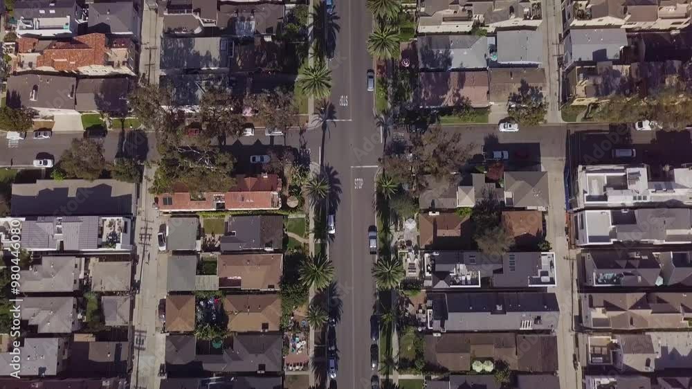 Aerial of a street in Laguna Beach, California, before tilting up to reveal the mountains on the horizon Aerial of a street in Laguna Beach, California, before tilting up to reveal the mountains on the horizon