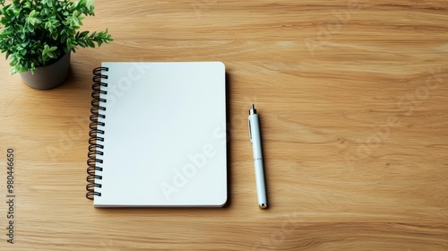 Minimalist desk setup, notebook and pen, soft natural lighting, wooden surface, Sony a7 III capture