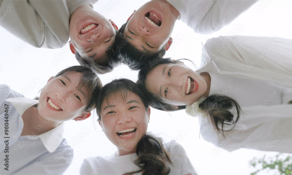 young beautiful people standing in circle and smiling excited at camera.