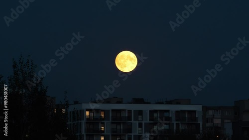 Fool moon rising over the city, supermoon.