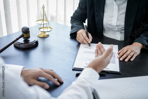 Male lawyer or notary working consulting and discussion to businesswoman client in the office, Law and Legal services concept photo