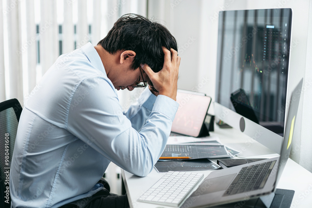 Businessman investor working and stress with computer analyzing graph stock market trading planning with chart data financial investment planning Businessman investor working and stress with computer analyzing graph stock market trading planning with chart data financial investment planning