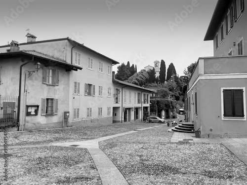 old house in the village,This black and white photograph captures the timeless charm of an ancient mountain village. These typically refer to traditional, historic homes constructed from stone