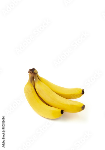 Three yellow bananas are sitting on a white background