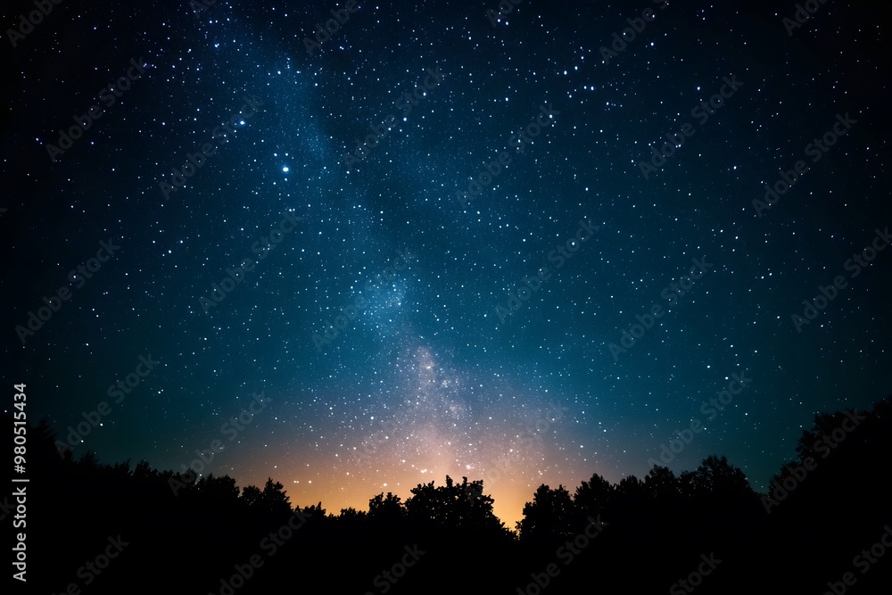 A dark night sky with stars and the Milky Way galaxy in view. A dark night sky with stars and the Milky Way galaxy in view.