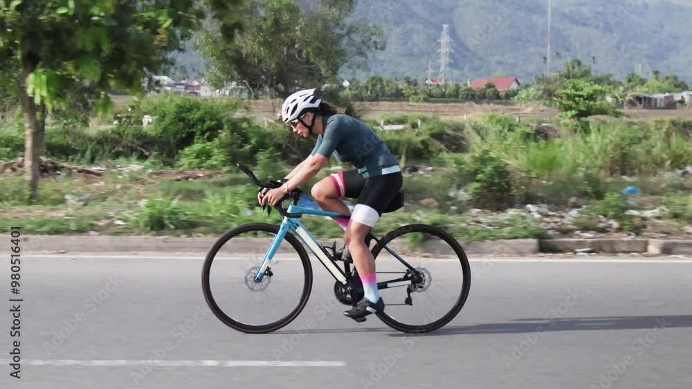 Cyclist perfects track skills during early morning training. Cyclist perfects track skills during early morning training.