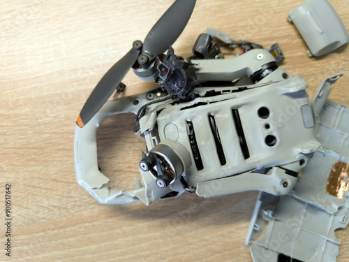 Broken drone after fall. Destroyed copter.