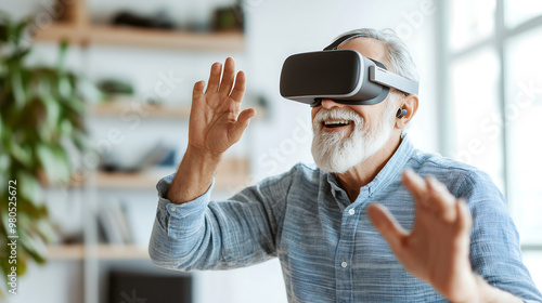 An Engaging Moment in Virtual Reality: An Elderly Man Revels in an Immersive Experience, Displaying Joy and Excitement as He Interacts with the Digital World Around Him. photo