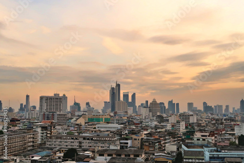 View onto the skyline of Bangkok before sunset, skyscrapers under a cloudy sky, Thailand
