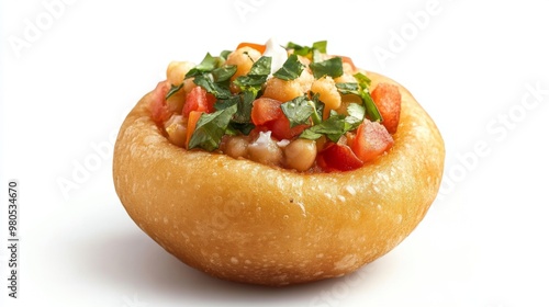 pani puri is filled with mint, chany and tomatoes, dahi oozing out of it photo