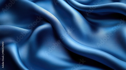 Smooth blue fabric draping elegantly in soft waves.