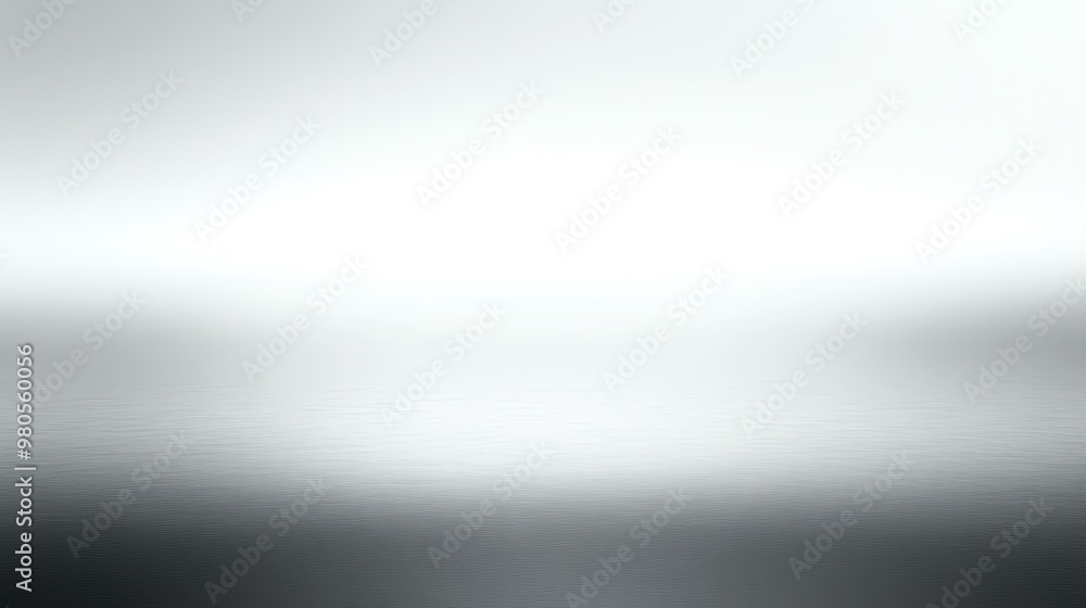 Obraz premium An abstract blurred background featuring soft shades of gray and white, creating a serene and minimalist atmosphere.