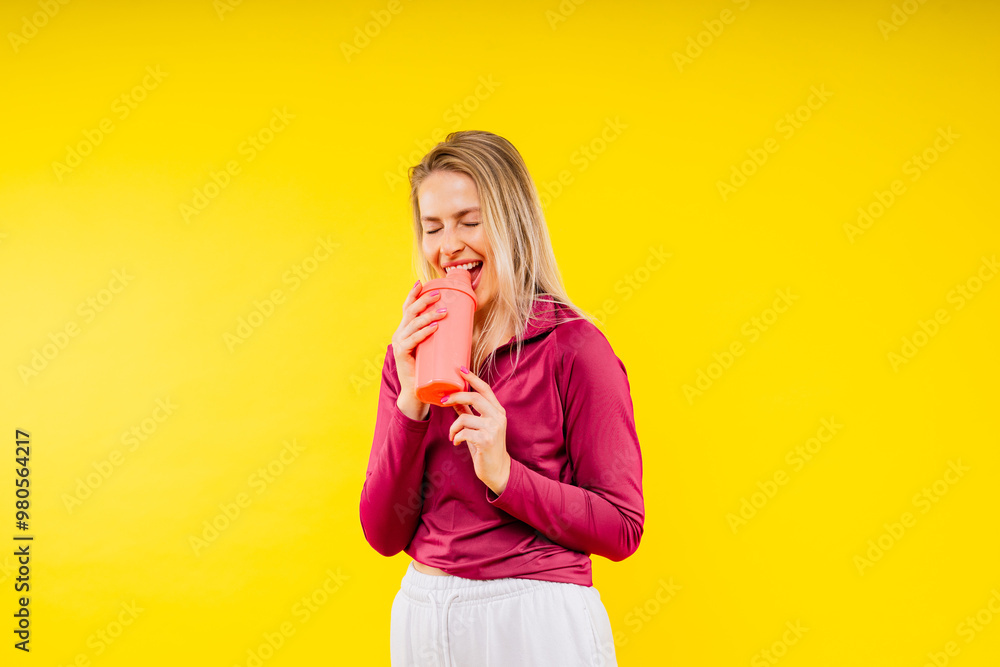Attractive woman and water bottle for body diet, health and wellness against a studio background. Attractive woman and water bottle for body diet, health and wellness against a studio background.