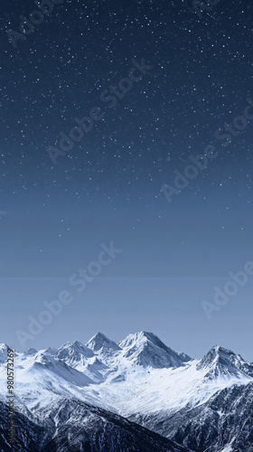 snowy mountain range under a starry sky at night