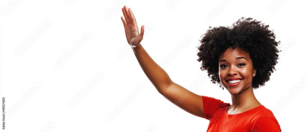 A joyful African American woman giving a high-five, demonstrating ...