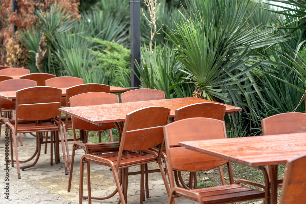 A cafe or restaurant on the street. Table and chairs in the resort town