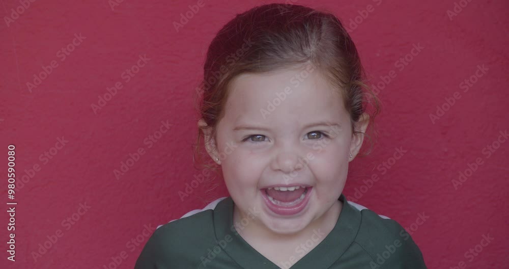 A little girl laughs and makes funny faces, her playful and silly expressions capturing the carefree joy and humor of childhood. A little girl laughs and makes funny faces, her playful and silly expressions capturing the carefree joy and humor of childhood.