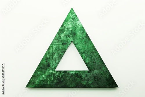 Mysterious silhouette of a green acute triangle in the shadows