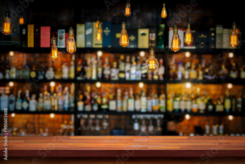 Wooden table with blurry liquor bar background