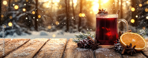 Steaming mug of mulled wine on a snowy forest table at sunset photo