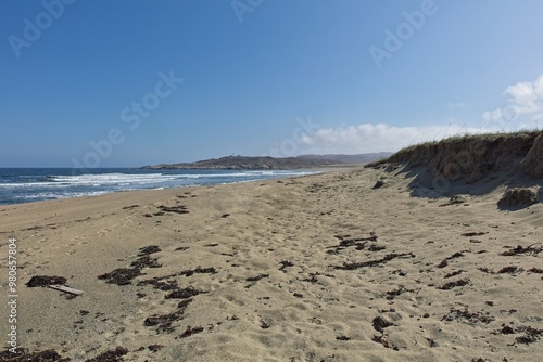 Beach landscape view near Russian border on a sunny spring day, Grense Jakobselv, Norway. photo