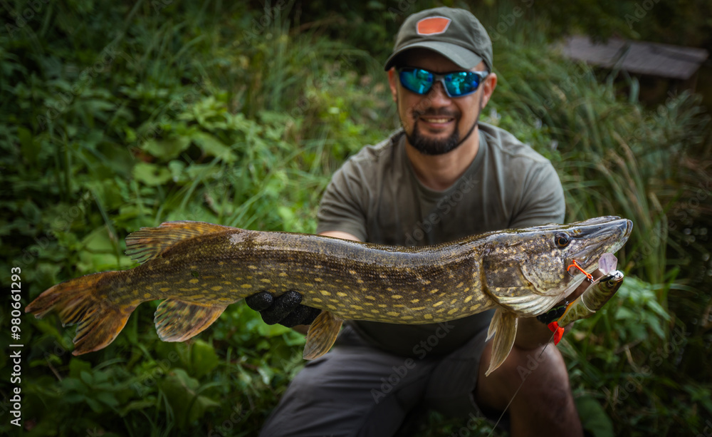 Fisherman and trophy Pike. Fishing background. Fisherman and trophy Pike. Fishing background.