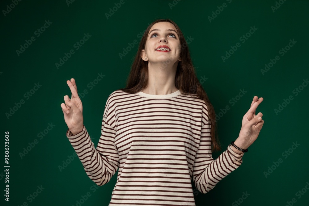 Woman Standing in Front of Green Wall Woman Standing in Front of Green Wall