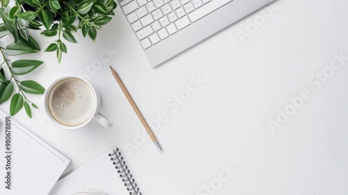 Flat office desk with white table top view. Workspace with notebook, pen, green leaf and coffee cup on white background