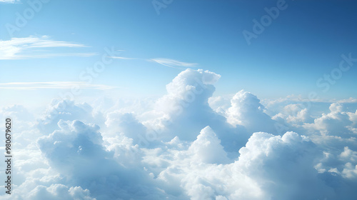 A Stunning View of Fluffy White Clouds Floating in a Vast Blue Sky, Captured From Above