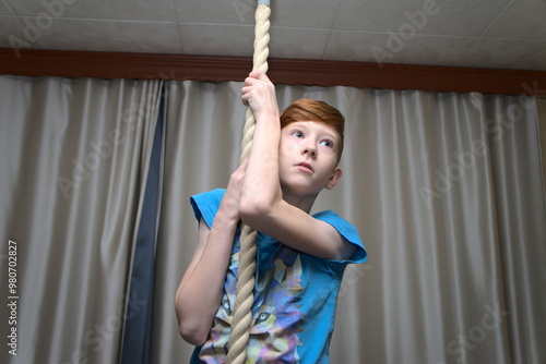 A boy on a tightrope. physical development