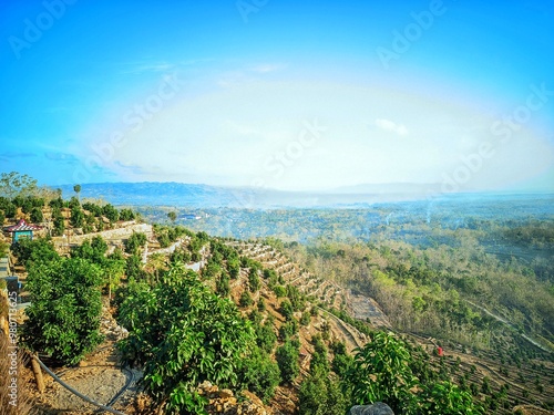 Beautiful view at Bukit Dewa Dewi, a tourist attraction with an agro-tourism concept with an avocado orchard on a limestone hill.