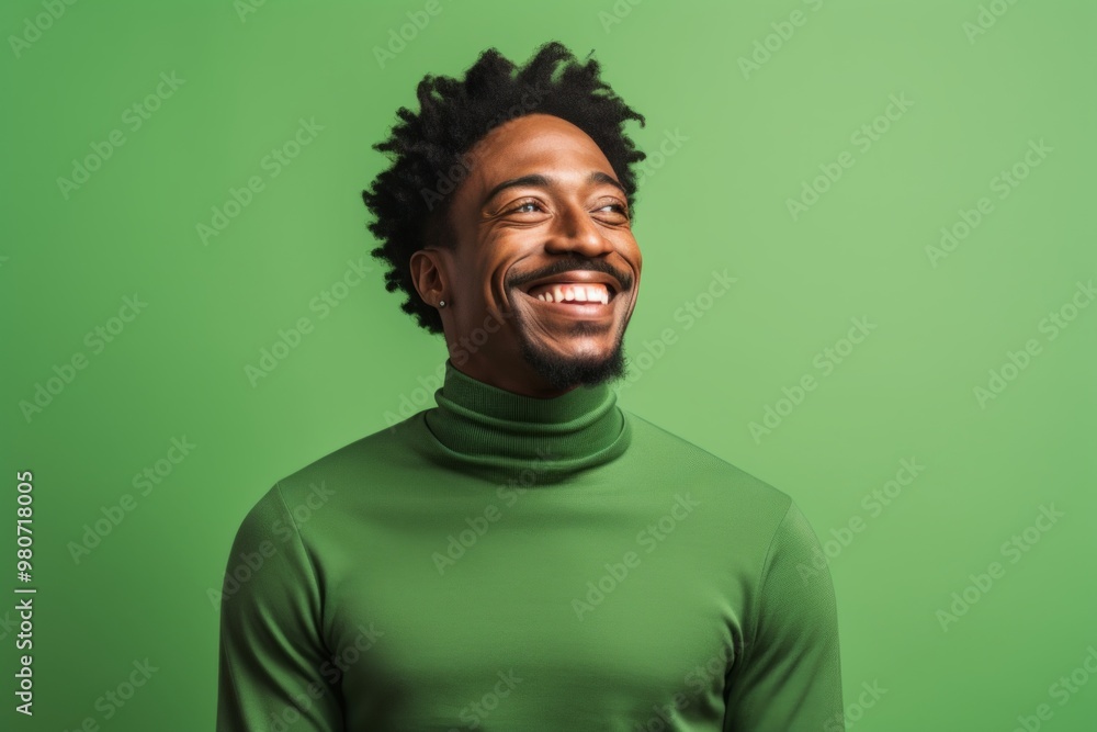 Portrait of a cheerful afro-american man in his 30s wearing a classic turtleneck sweater in soft green background Portrait of a cheerful afro-american man in his 30s wearing a classic turtleneck sweater in soft green background