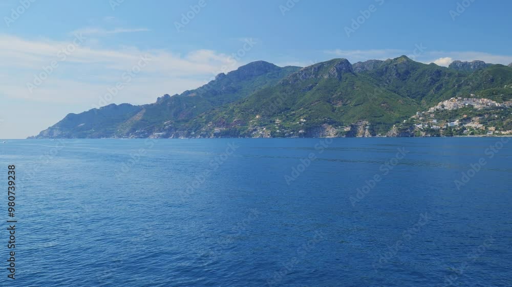 Salerno, Italy. Seascape of the Amalfi Coast, from the port of Salerno to Vietri sul Mare, Raito and Albori. Taken from a moving boat sailing along the Amalfi Coast. Real time 4K pan video. Salerno, Italy. Seascape of the Amalfi Coast, from the port of Salerno to Vietri sul Mare, Raito and Albori. Taken from a moving boat sailing along the Amalfi Coast. Real time 4K pan video.