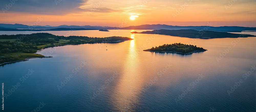 Aerial drone shot of a serene lake coast at sunset with islands and a clear view ahead ideal for use as a copy space image Aerial drone shot of a serene lake coast at sunset with islands and a clear view ahead ideal for use as a copy space image
