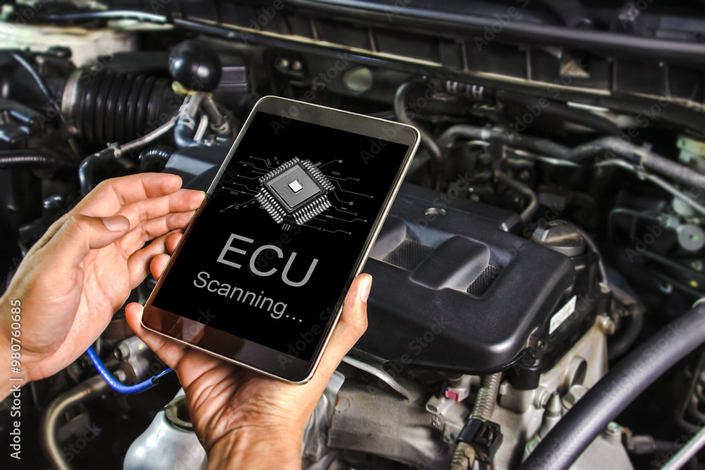 Technician checking the car electronic control unit system or ECU with a scan tool , Car repair concept