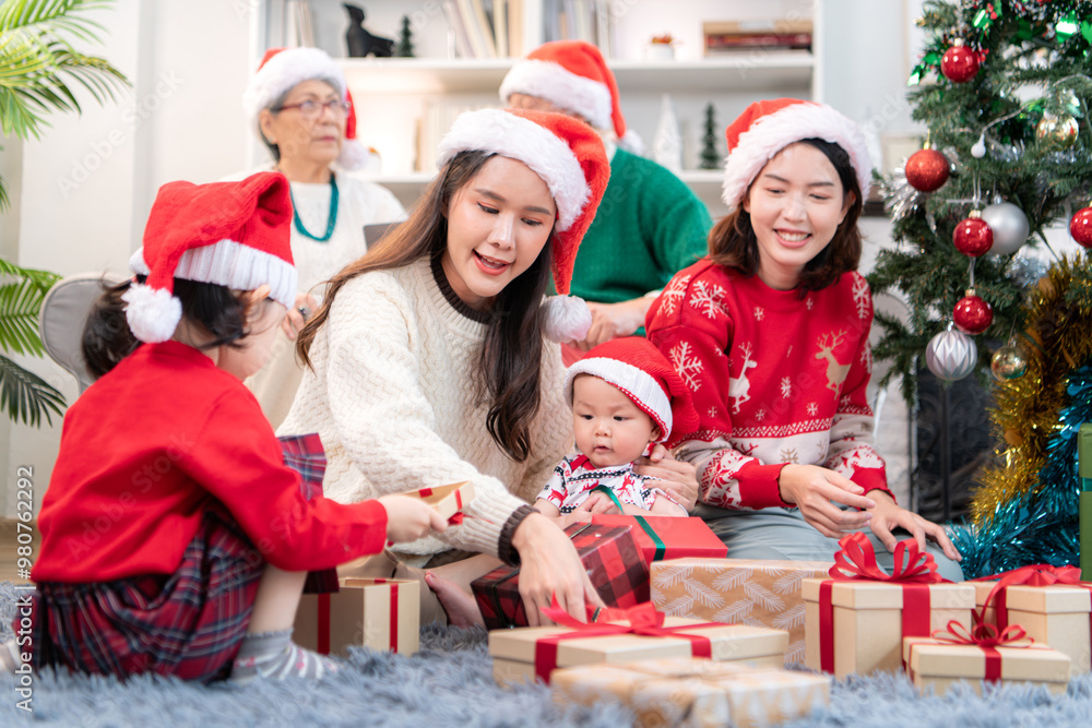 A joyful moment for a large family celebrating together at home during the Christmas season A joyful moment for a large family celebrating together at home during the Christmas season