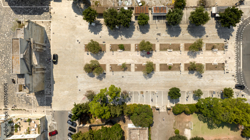 Zenithal aerial view of Porta Napoli and the adjacent tree-lined square. It is one of the entrances to the historic center of Lecce, Puglia, Italy. photo