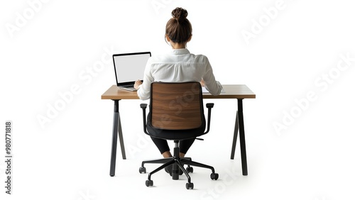 back view of full body of a 35 years woman with short hair wearing a white shirt and black trousers sitting in an office chair and writing on a desktop apple computer on a wood office desk 