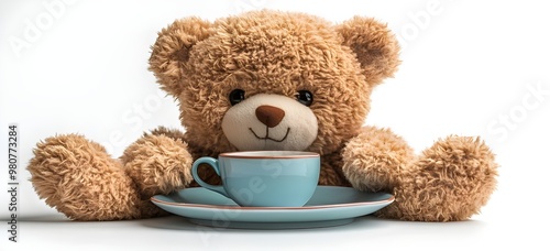 a teddy bear holding a cup of tea

