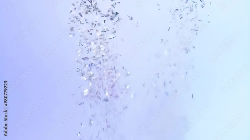 Silver and lavender confetti burst on soft pastel blue background for calm celebration Silver and lavender confetti burst on soft pastel blue background for calm celebration
