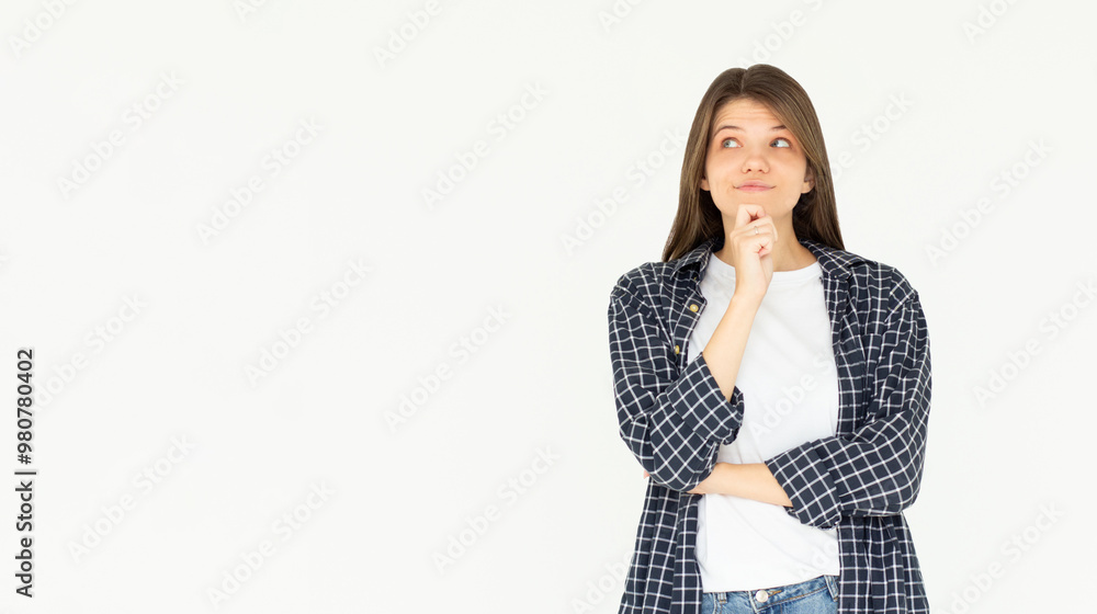 Cute woman thinking about smth. Young brunette student girl is thoughtful on white background Cute woman thinking about smth. Young brunette student girl is thoughtful on white background
