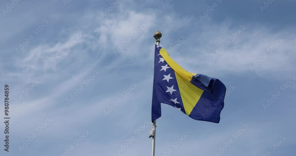 Video of Bosnia and Herzegovina flag, blue and yellow with isosceles
