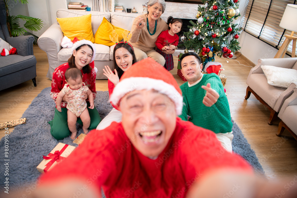 A joyful moment for a large family celebrating together at home during the Christmas season A joyful moment for a large family celebrating together at home during the Christmas season