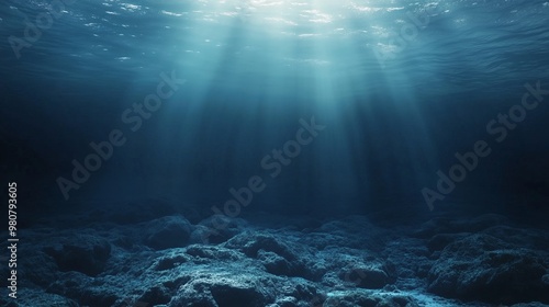Underwater view of deep ocean water with sunlight shining through the surface