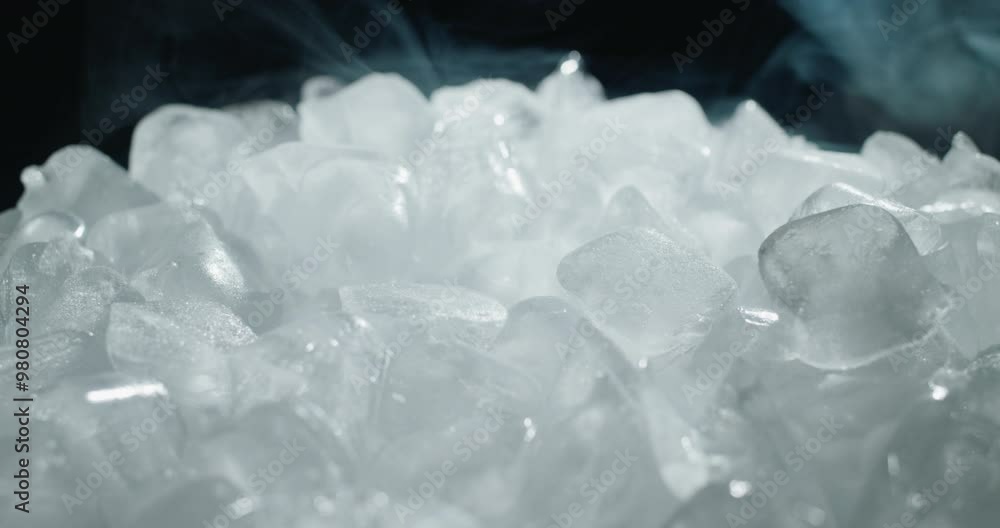 Swirling mist hovers above the ice cubes Swirling mist hovers above the ice cubes