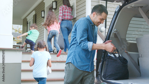 Family In Car Arriving Home...