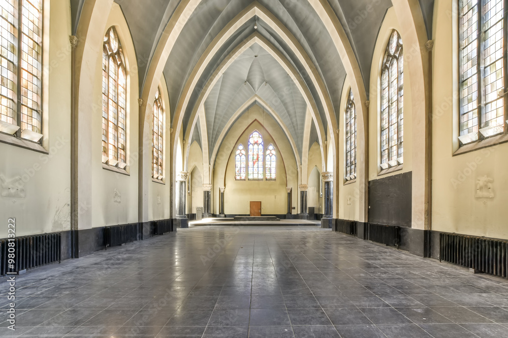 Spacious Gothic style church interior with arched windows Spacious Gothic style church interior with arched windows