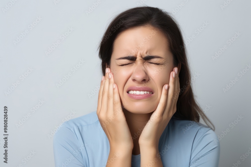 Woman experiencing severe toothache pain Woman experiencing severe toothache pain